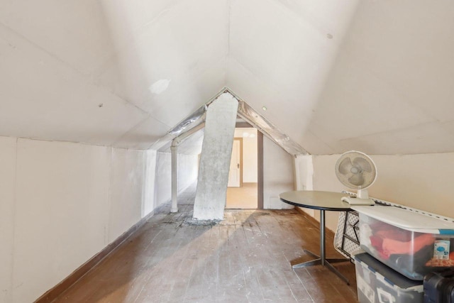 bonus room with vaulted ceiling and hardwood / wood-style floors