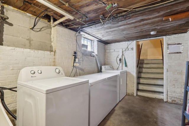 clothes washing area with washing machine and dryer and laundry area