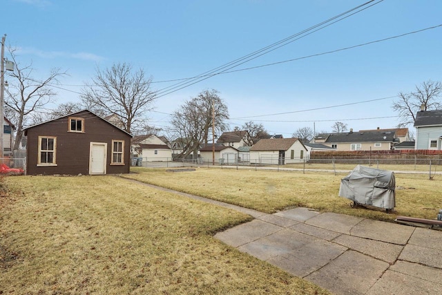 view of yard featuring an outbuilding and a fenced backyard