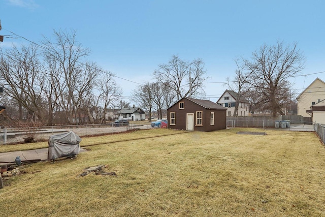 view of yard with an outbuilding and a fenced backyard