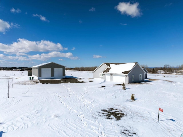 exterior space with an outbuilding and a garage