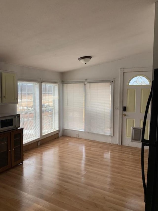 unfurnished living room with light wood-style floors