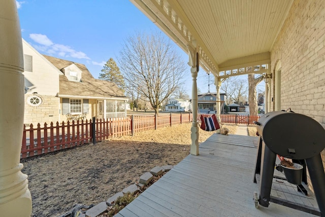 deck featuring a residential view and a fenced backyard