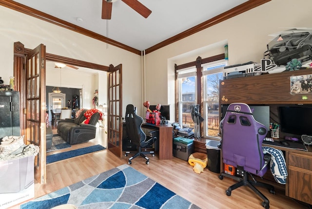 office with a ceiling fan, wood finished floors, crown molding, and french doors