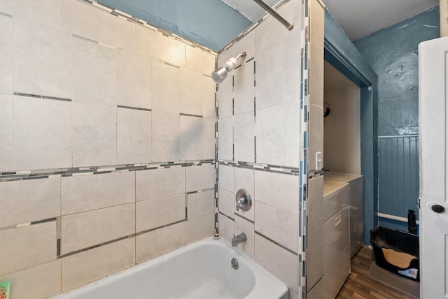 full bathroom featuring shower / bath combination and wood finished floors