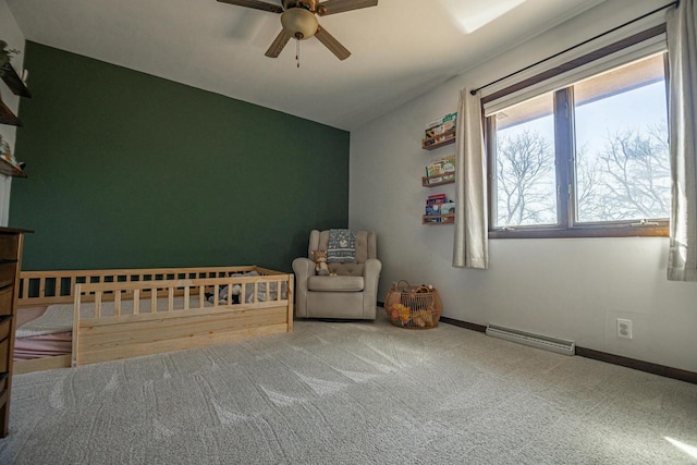 unfurnished bedroom featuring carpet, baseboards, visible vents, ceiling fan, and vaulted ceiling