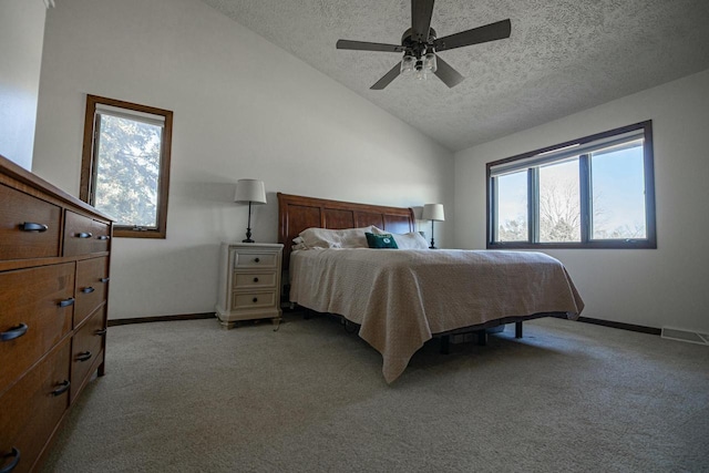 bedroom featuring baseboards, visible vents, lofted ceiling, a textured ceiling, and light carpet