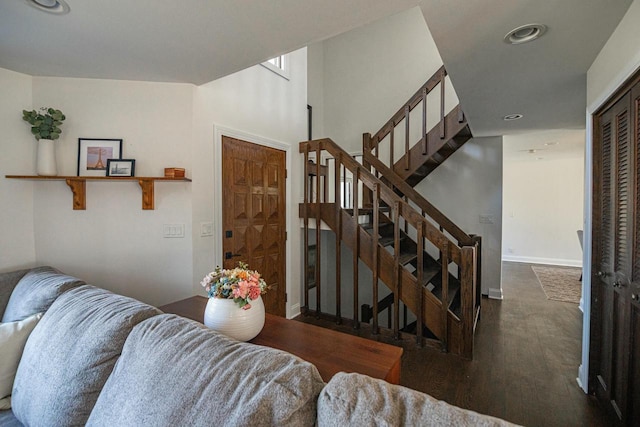 staircase featuring recessed lighting, baseboards, and wood finished floors