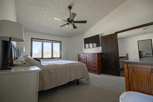 carpeted bedroom featuring ceiling fan, vaulted ceiling, and a textured ceiling