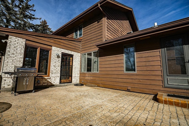 rear view of house featuring a patio