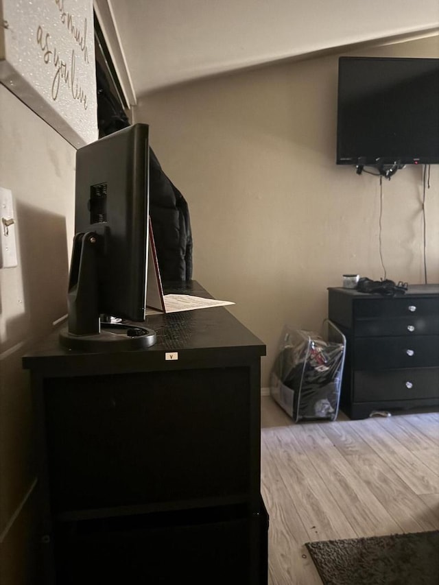 bedroom featuring wood finished floors