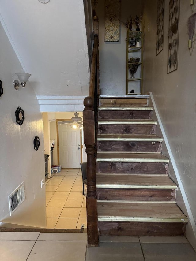 staircase with visible vents and tile patterned flooring