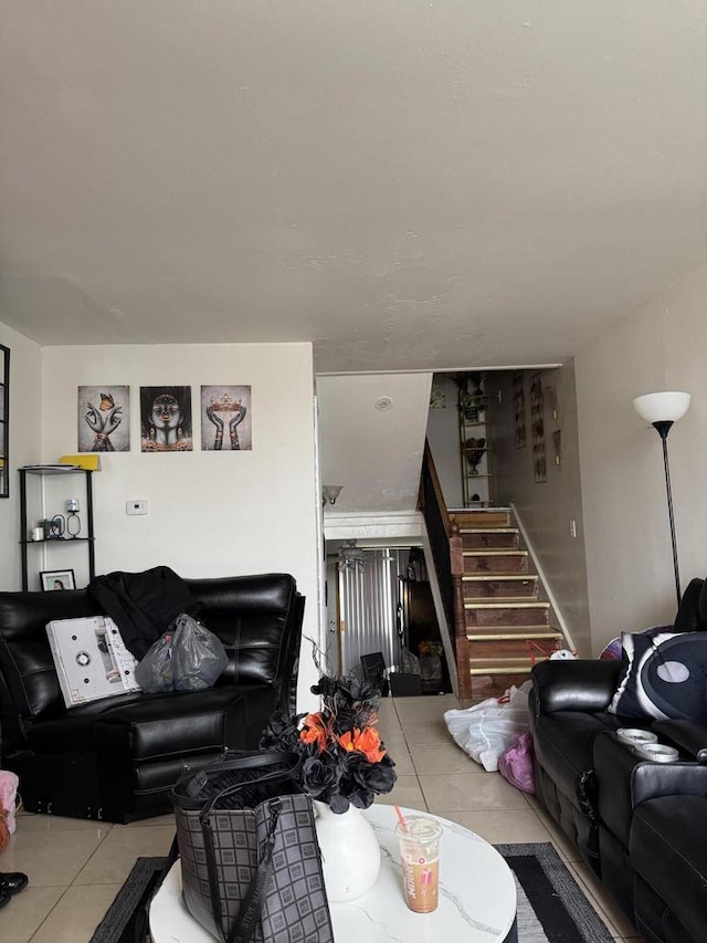 living room with tile patterned flooring and stairs