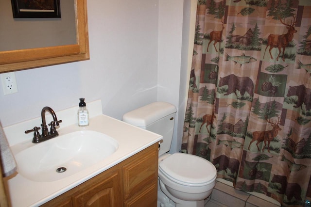 bathroom featuring curtained shower, toilet, and vanity