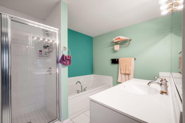 full bathroom featuring tile patterned floors, a stall shower, vanity, and a bath