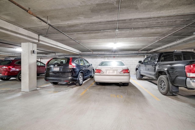 parking deck featuring concrete block wall