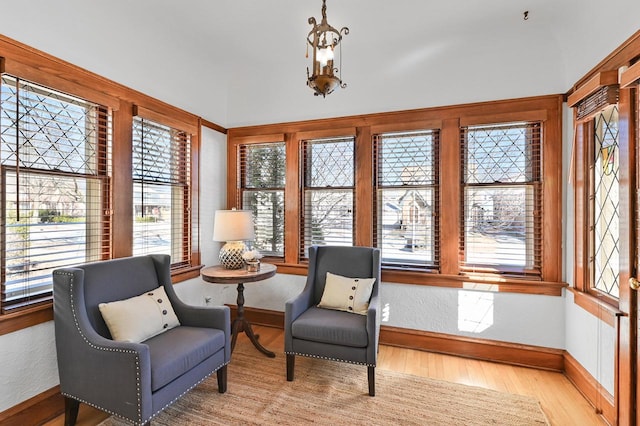 sitting room with wood finished floors and baseboards