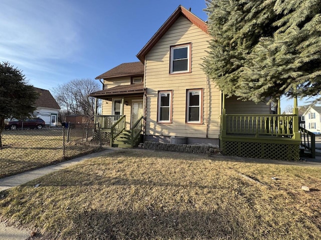 view of front of house with fence