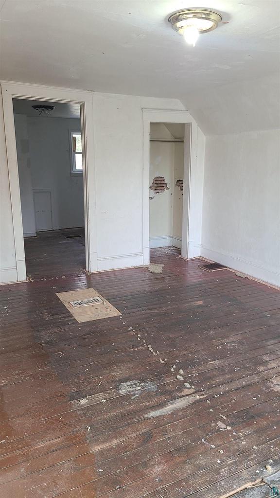 spare room featuring hardwood / wood-style floors