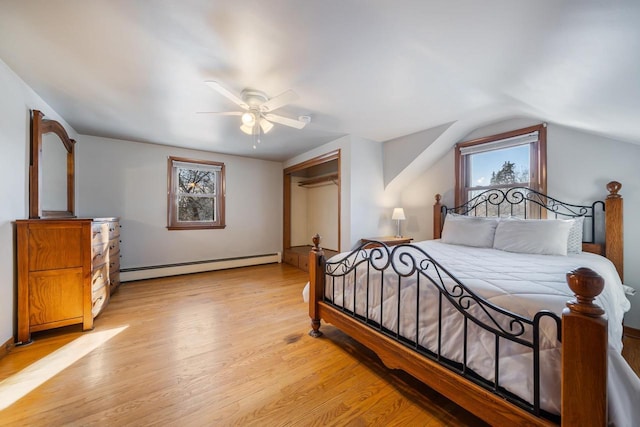 bedroom with baseboard heating, a ceiling fan, lofted ceiling, and light wood-style floors