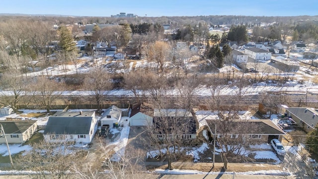 snowy aerial view featuring a residential view