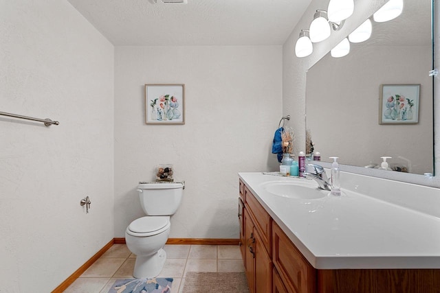 half bath with vanity, tile patterned floors, toilet, and baseboards