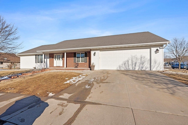 ranch-style house with brick siding, driveway, a garage, and roof with shingles