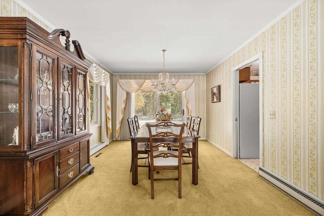 dining room featuring a baseboard heating unit, light colored carpet, ornamental molding, and wallpapered walls