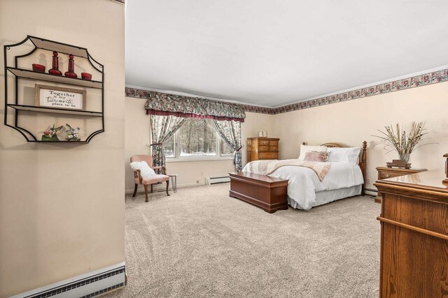 bedroom with a baseboard radiator, a baseboard heating unit, and carpet flooring