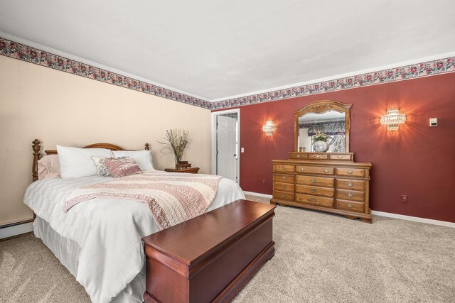 bedroom featuring light carpet and baseboards