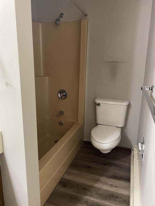 full bathroom with toilet, shower / tub combination, and wood finished floors