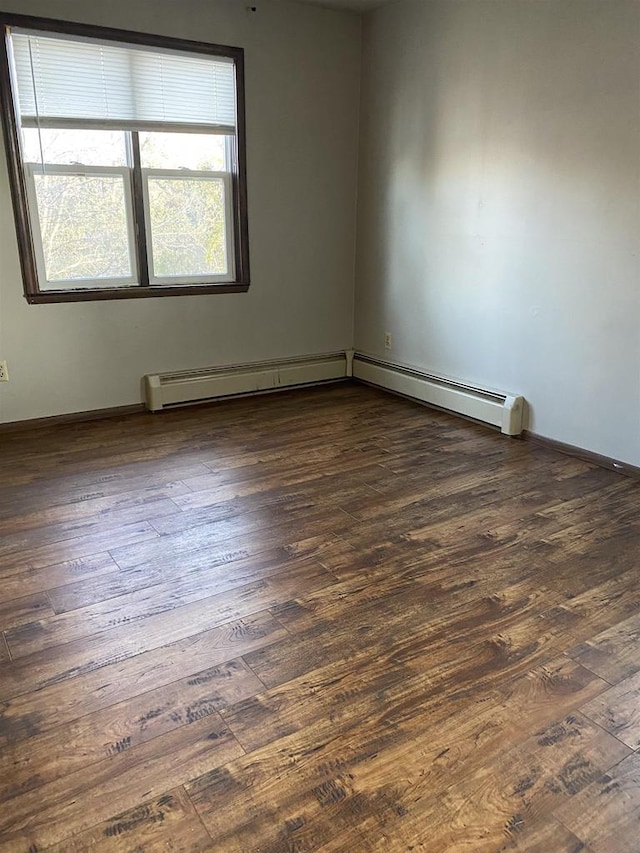 unfurnished room with wood finished floors