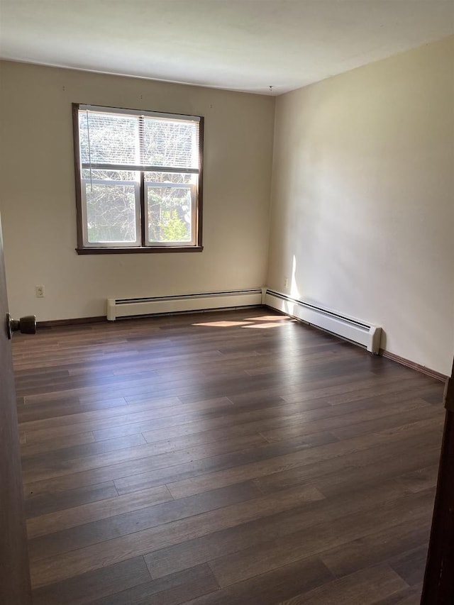 spare room featuring wood finished floors