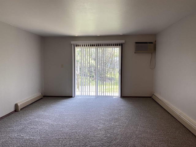 carpeted spare room with an AC wall unit, baseboards, and a baseboard radiator