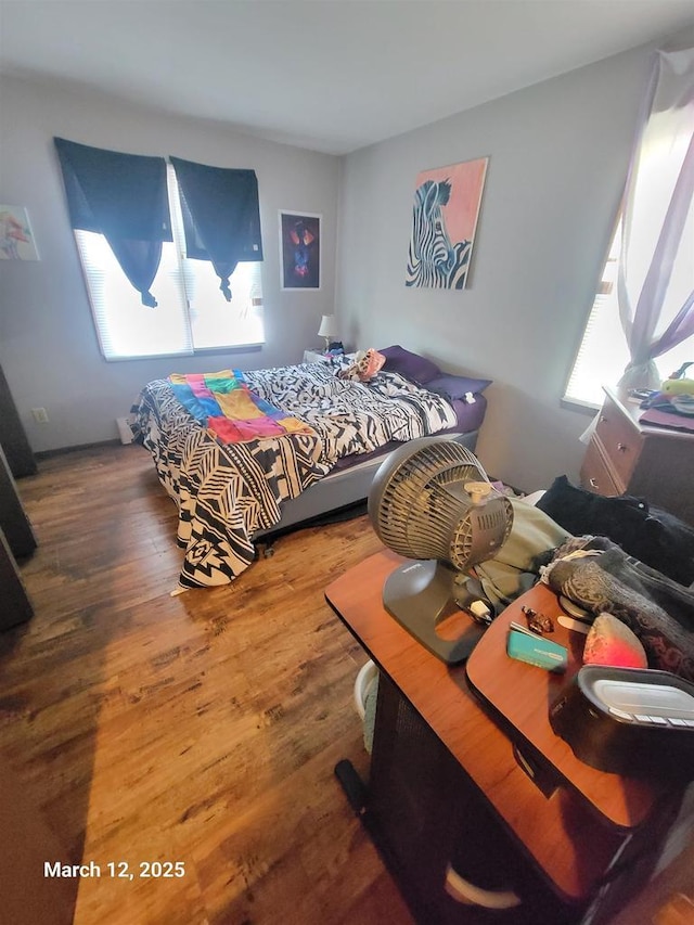 bedroom with wood finished floors