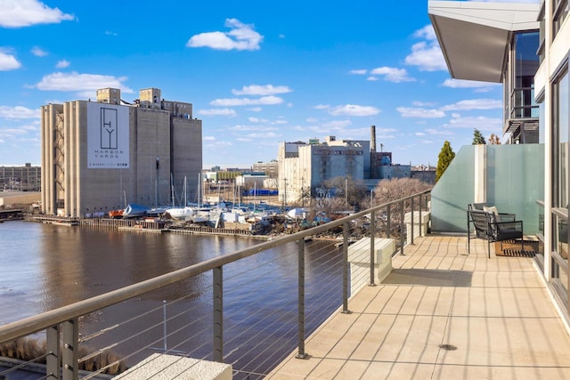 balcony with a city view and a water view