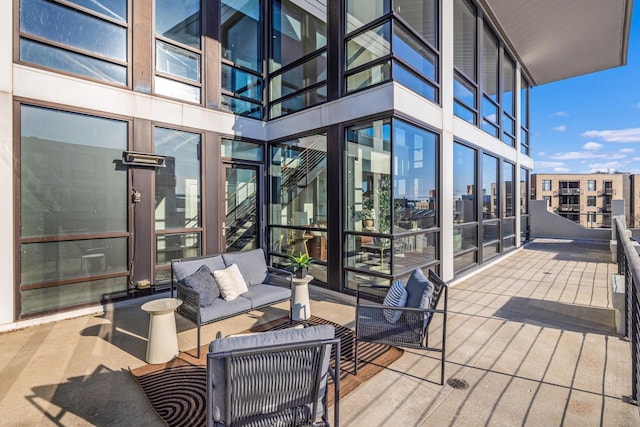 wooden terrace with outdoor lounge area