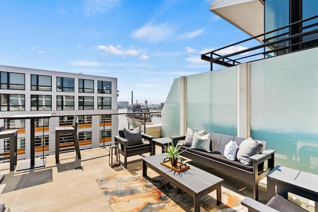 balcony featuring a city view and an outdoor hangout area