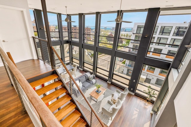 sunroom with a city view and a ceiling fan