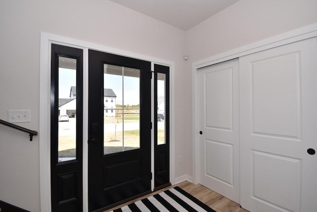 entrance foyer featuring baseboards and light wood-style floors