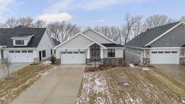 view of front of property with concrete driveway, a garage, and stone siding