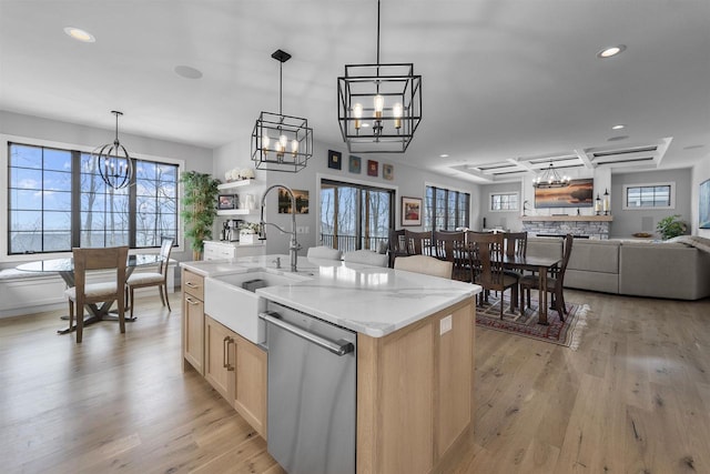 kitchen with light wood-style flooring, a sink, recessed lighting, dishwasher, and a chandelier