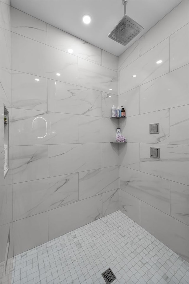 full bathroom with tiled shower