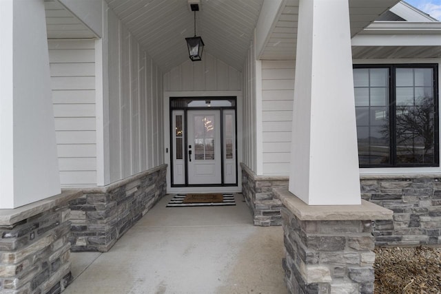 entrance to property with stone siding