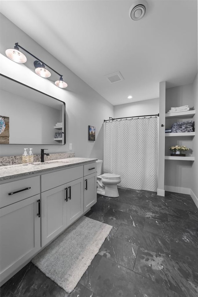 full bath with baseboards, toilet, a shower with shower curtain, marble finish floor, and vanity