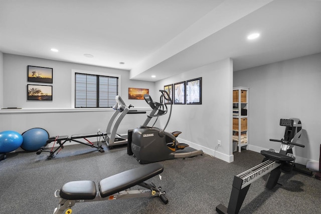 exercise room with recessed lighting, baseboards, and a wealth of natural light