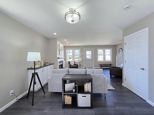 interior space with recessed lighting, baseboards, and dark wood-style flooring