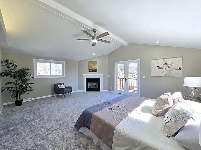 bedroom featuring multiple windows, lofted ceiling with beams, french doors, carpet floors, and access to exterior