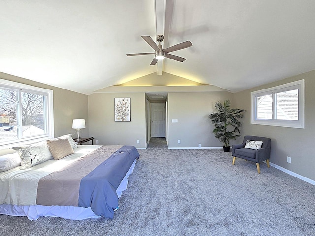 bedroom featuring carpet flooring, a ceiling fan, baseboards, and vaulted ceiling