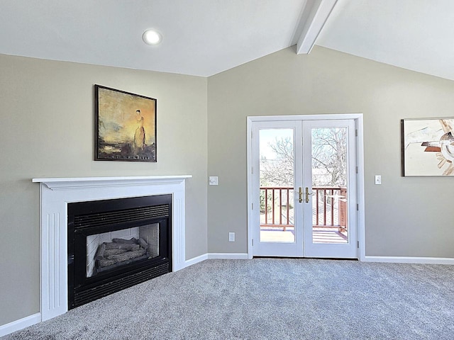 unfurnished living room featuring baseboards, carpet floors, lofted ceiling with beams, french doors, and a glass covered fireplace